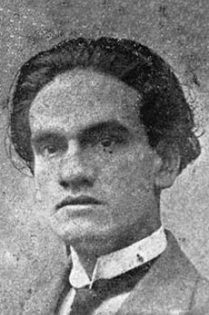 Early portrait of César Vallejo, dark wavy hair and a high white collar